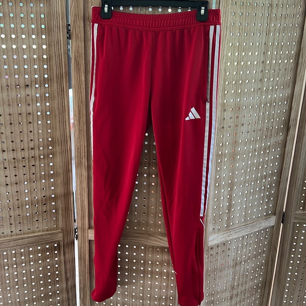 Red and white adidas track pants